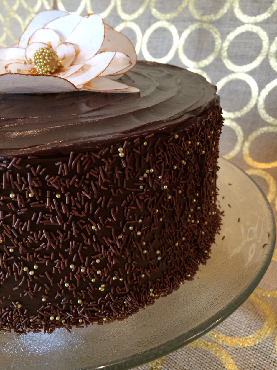dark chocolate ganache cake with magnolia