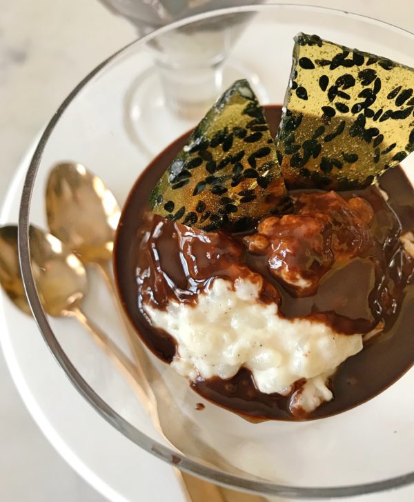 Rice Pudding with Chocolate-Tahini Sauce and Black Sesame Praline